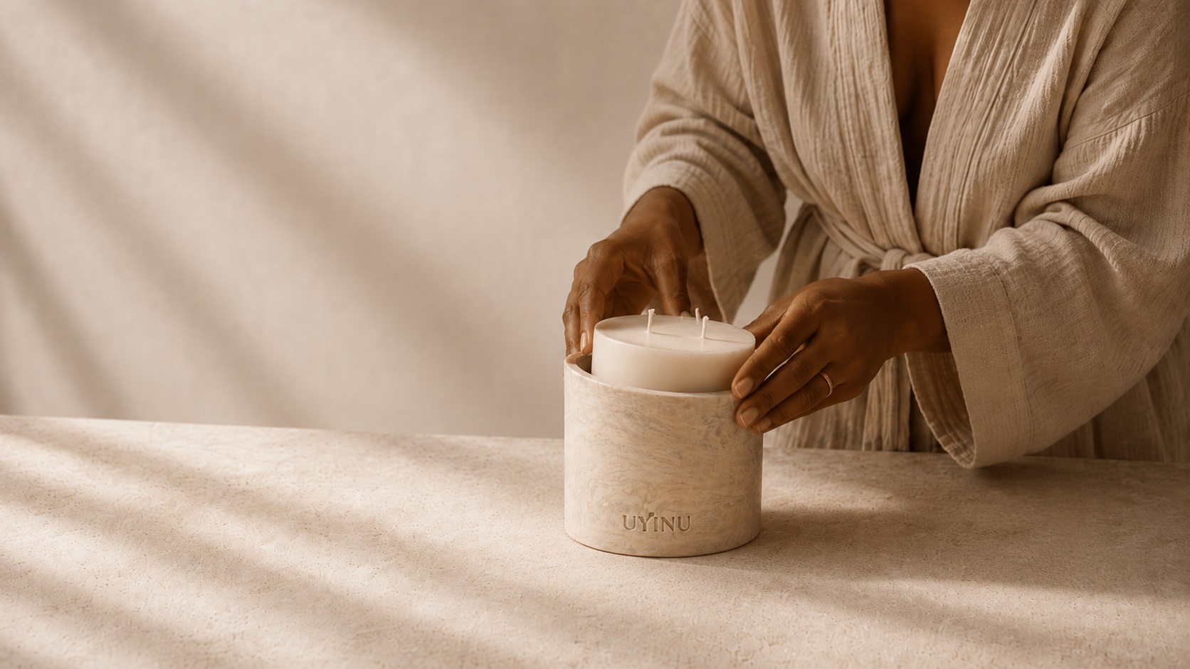 uyinu candle in a calm neutral setting